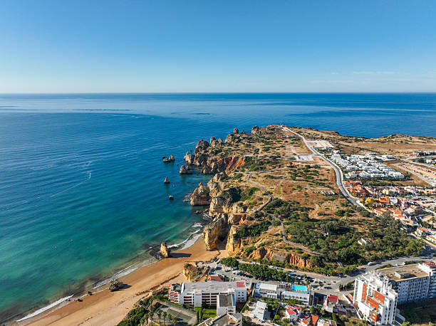 istock Lagos Portugal coastline with cliffs and beach 2214338803