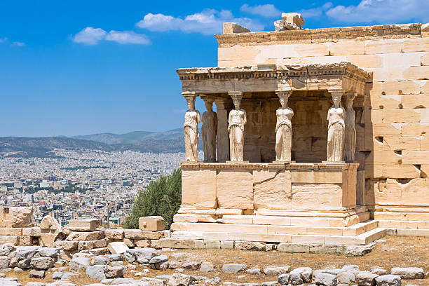 istock Ancient Caryatids Overlooking Modern Athens Skyline 2214339444