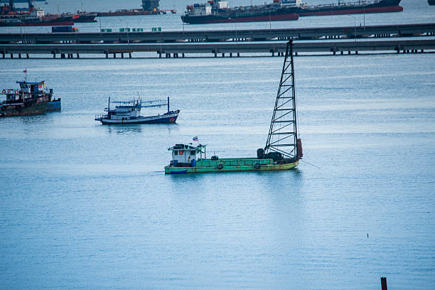 Logistic shipping quay boat Engineering crane depot at logistic export terminal control. Warehouse freight background container yard loading quayside harbor port. Logistics seascape shipping portal