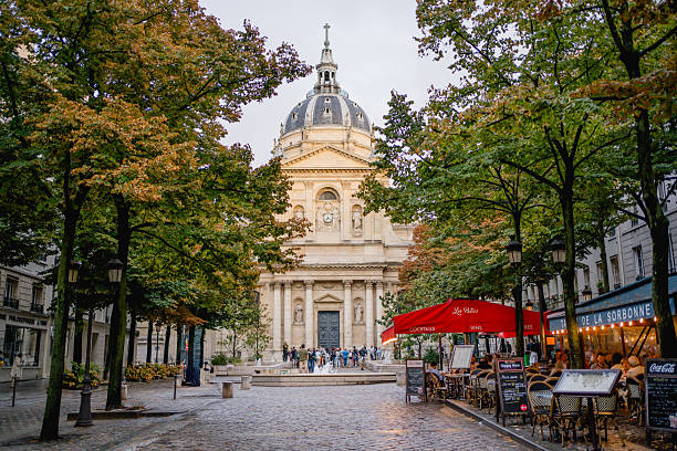 France, Paris - September 12, 2023: Tourists and students walking in front of the Sorbonne university chapel in Paris, France