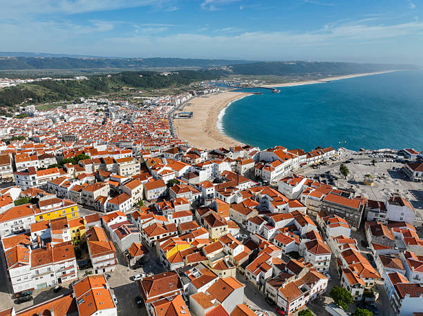 istock Praia da Nazare beach and rooftops aerial view 2214345136