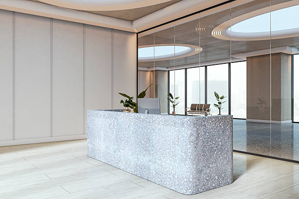 istock Modern empty reception desk in a bright office interior with terrazzo counter and glass wall overlooking city view in contemporary building hallway. 3D Rendering 2214346201
