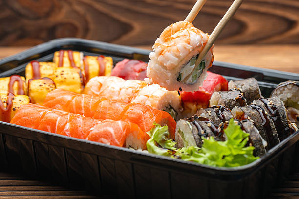 istock Sushi roll set. We chose shrimp sushi with chopsticks 2214346451