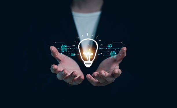 istock Hand of  holding illuminated light bulb, Idea innovation and inspiration concept.  creativity with bulbs that shine glitter, Concept for success. 2214355819