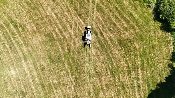 istock a tractor in the field shot with a drone 2214356933
