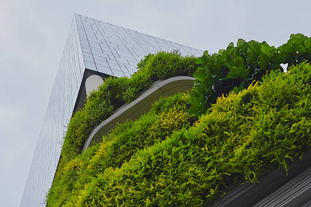 istock Modern architectural structure with lush greenery in urban setting captures sustainable design principles during cloudy day 2214358183