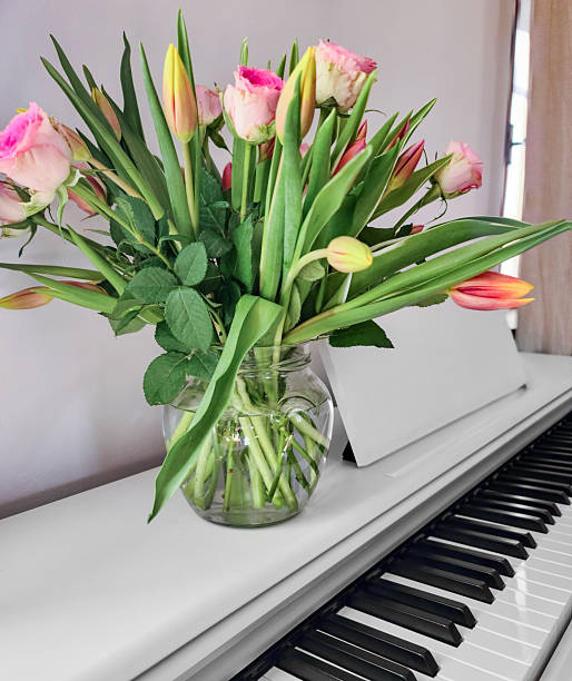 istock Fresh Flower Bouquet on White Piano 2214358583