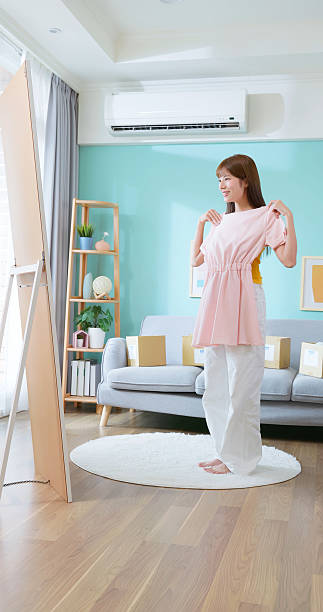 istock Woman try e-commerce dress happy 2214359050