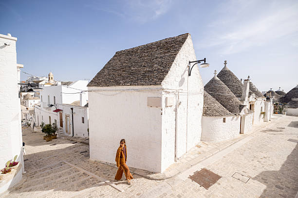 istock Walking through Alberobello's sunlit streets 2214362987