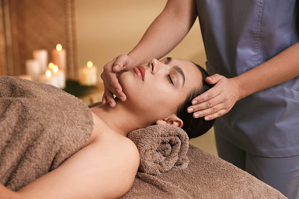 istock Woman receiving face massage in spa salon 2214375182