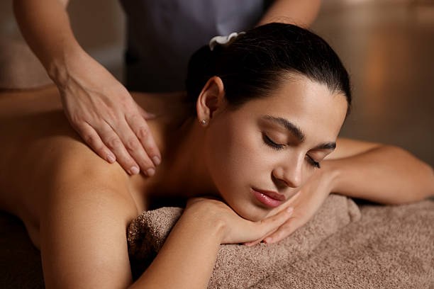 istock Woman receiving back massage in spa salon 2214375455