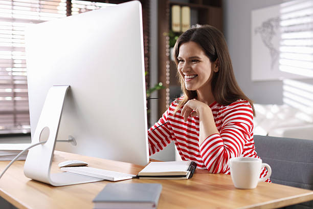 istock Happy woman working with computer at desk indoors. Home office 2214376872