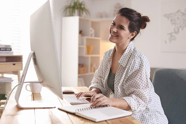 istock Happy woman working with computer at desk indoors. Home office 2214377071