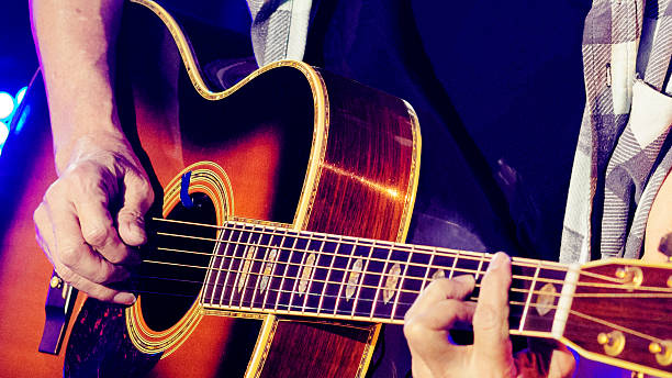 istock Close-up of man playing guitar 2214377105