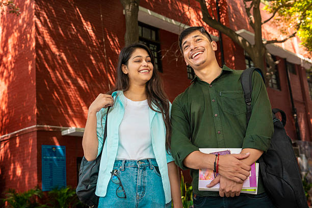 istock Students with books and backpack standing in a school campus 2214379068