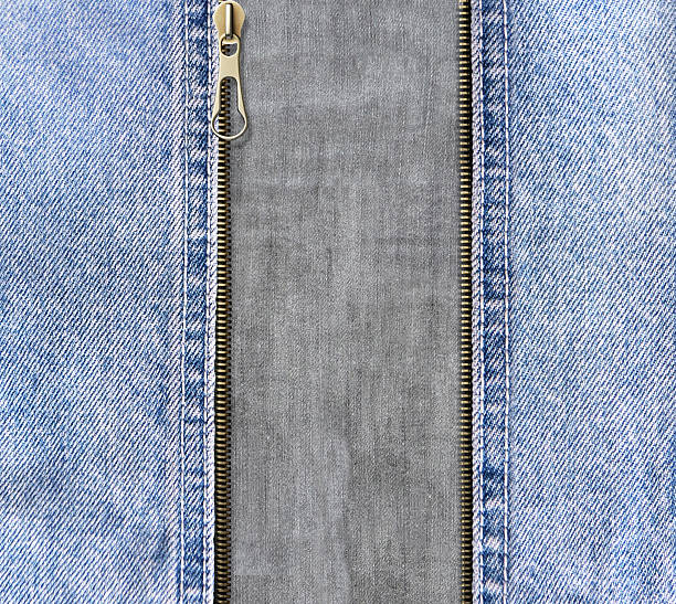 istock Square background with blue denim borders, zipper opened and gray cotton texture. Decorative backdrop with Unzipped zipper or fastener, light blue and gray color jeans fabric. Copy space for text 2214385870