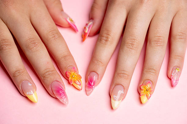 istock Beauty hands with acryllic nails and gel coating 2214388275