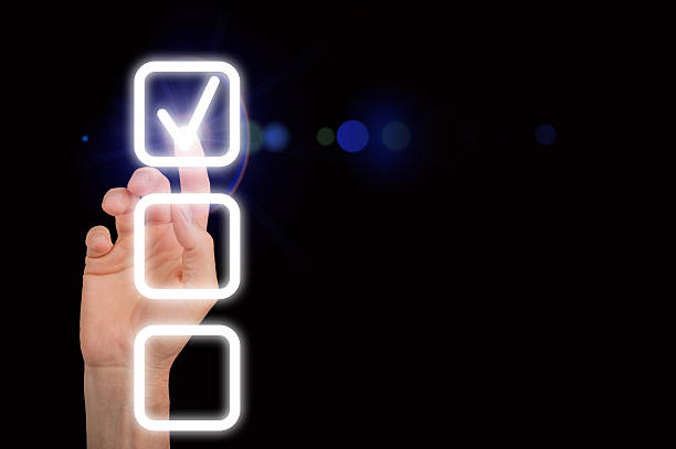 istock A glowing checkmark on a digital checklist, symbolizing completion and success. The finger taps the 2214389861