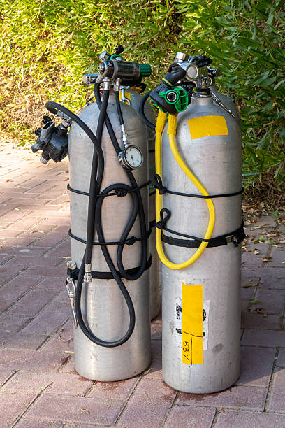 Compressed air tanks waiting to be loaded for a dive trip. Ambergris Caye, Belize. Central America.