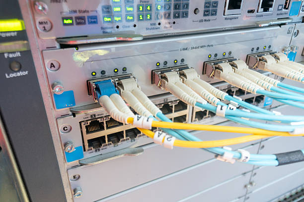 istock Network Equipment with Fiber Optic Cables 2214393414