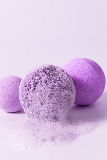 istock Relaxing lavender bath bombs create bubbles in a calming setting with soft purple colors 2214396273