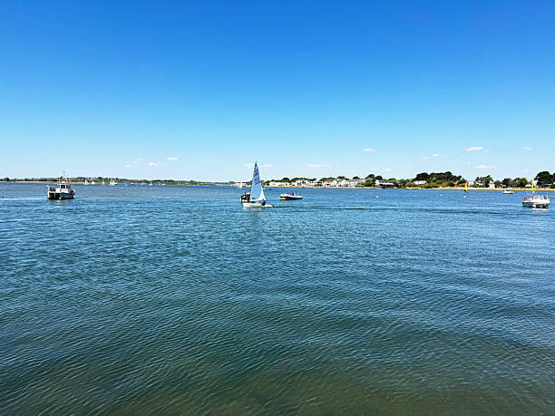 Small boats and dinghies in Christchurch Harbour in Mudeford