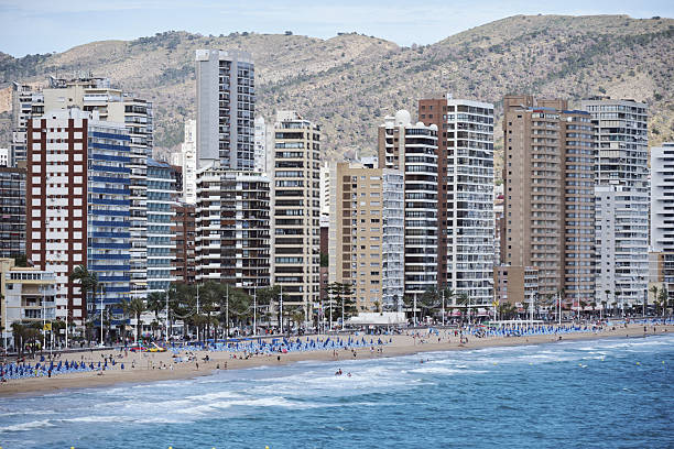 istock Vibrant coastal cityscape with tall buildings and busy beachfront activity 2214401499