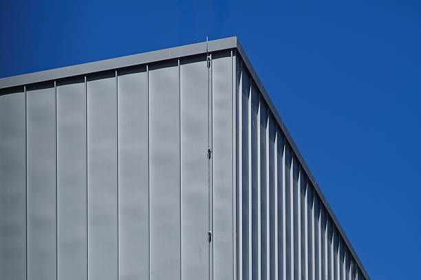 istock Modern building exterior with metal cladding against blue sky 2214402711