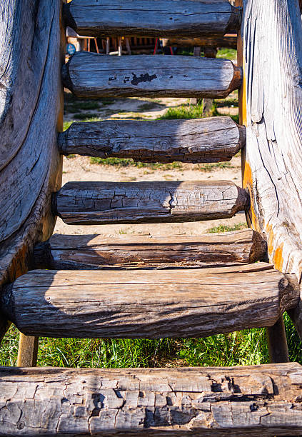 istock Rustic Wooden Slide in a Playground 2214403130