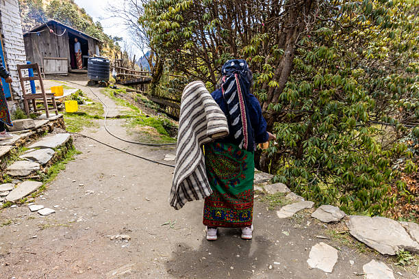 Pokhara, Nepal. People on Annapurna Base Camp trek in Nepal. Nepali remote village people in Himalaya mountains on the popular hiking path. Old women in Nepal smiling to the tourists