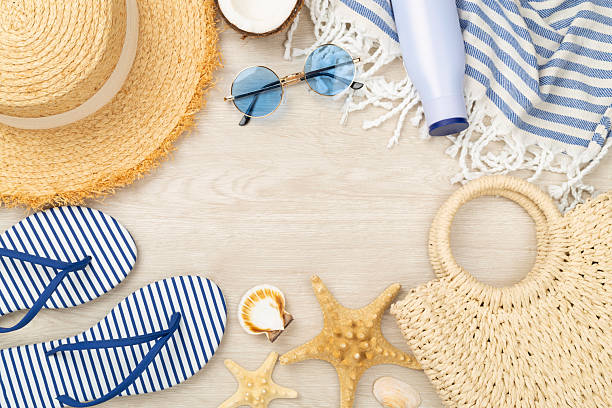 istock Blue beach accessories on wooden background, top view. Copy space for text 2214404159