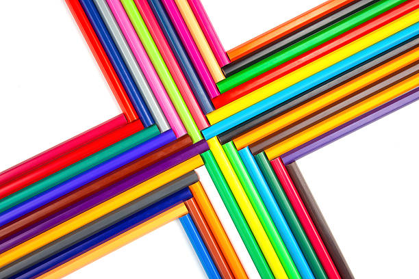istock A spectrum of sharpened colored pencils arranged in a flowing pattern on a white background. Great for illustrating creativity, school supplies, or art-related concepts. 2214405718