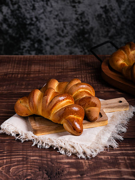 istock Golden-Brown Croissants on Rustic Wooden Board 2214407008