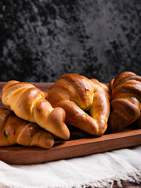 istock Golden-Brown Croissants on Rustic Wooden Tray. Copy space. 2214407013
