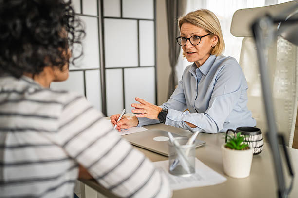 istock Two female colleagues are consult about work at office 2214412467