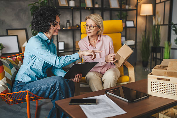 istock two women entrepreneur at home pack boxes product order for delivery 2214412963