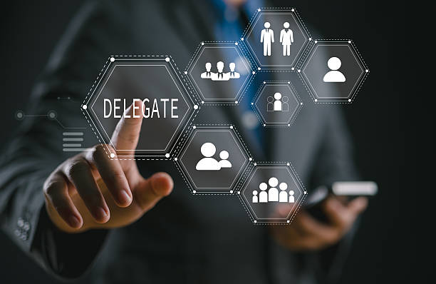 istock Delegation concept. Business work organization and management. Supervisors delegate work rights to other people on the team. 2214414660