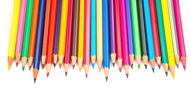 istock A vibrant row of sharpened colored pencils in various hues against a white background. Perfect for art supplies, creativity, and back-to-school themes. 2214417907