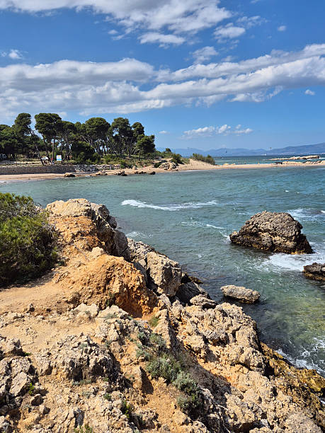 istock A visit to El Portitxol which has Rock formations, including a unique arch, surround this sandy cove attracting swimmers and sunbathers. 2214420009