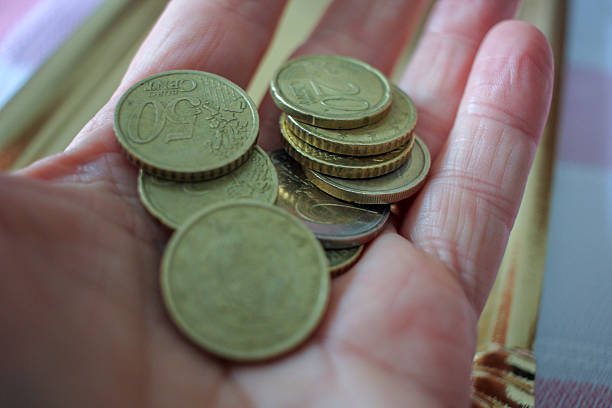 istock euro coins in my left hand 2214420285
