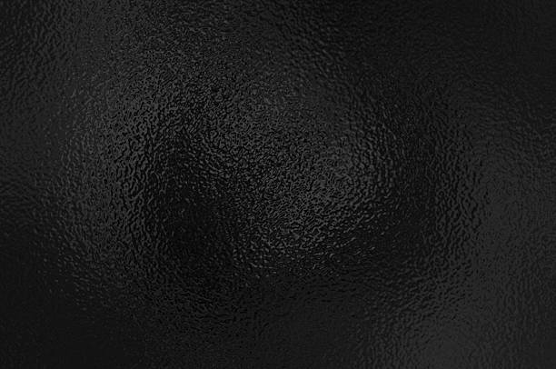 istock Black foil glass texture background. Abstract gradient bright light reflection and shiny rough texture surface. Glass effect background 2214430747