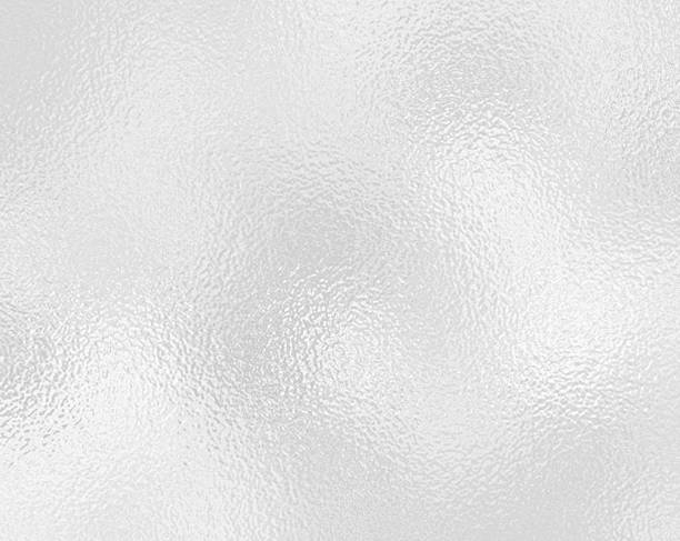 istock Silver gray foil texture glass effect background, gray platinum metallic texture. Silver gradient background. Foil paper, glitter effect. Chrome metal gray pattern. Gradation noise texture 2214431372