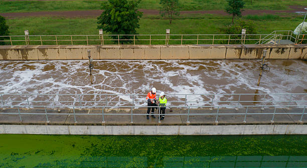 istock Top view Two environment engineers working on a Wastewater treatment system or a Sewage treatment process, Industrial and environmental 2214437866