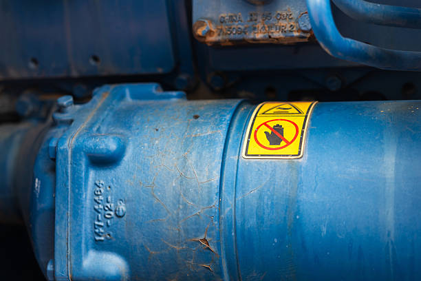 istock Hand and finger injury caution sign on machine part. 2214450195