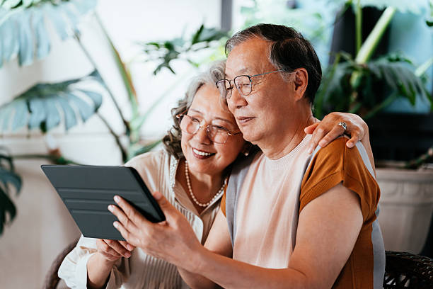 istock Asian senior couple using digital tablet in the yard. 2214450530