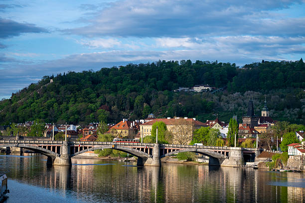 Aerial view across river to old town in springtime, Prague