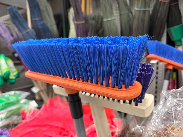 istock Bright blue cleaning brush displayed among various tools in a store 2214460365