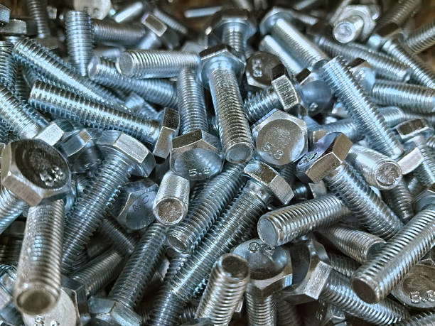 istock Metal fasteners cover the workbench in a workshop during daytime 2214460367