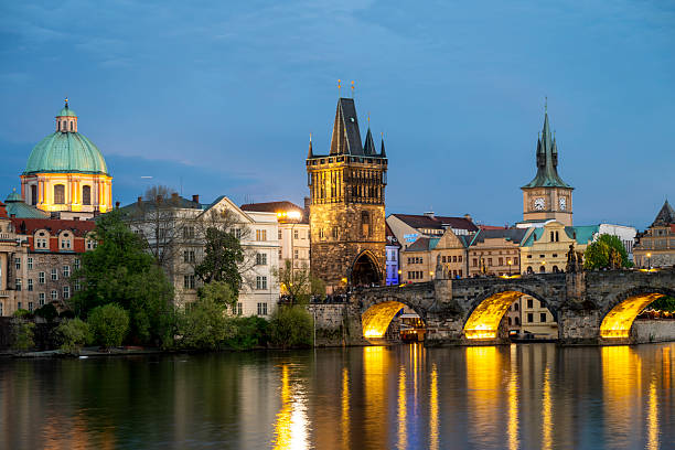 istock View across river to old town and bridge at dusk, Prague 2214461502