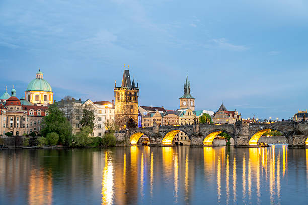istock View across river to old town and bridge at dusk, Prague 2214461630